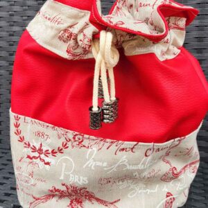 Pochon ou trousse de toilette en simili cuir rouge et tissu beige avec textes