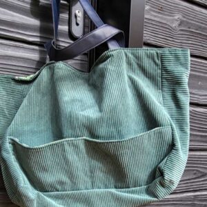Sac en velours turquoise avec poche extérieur